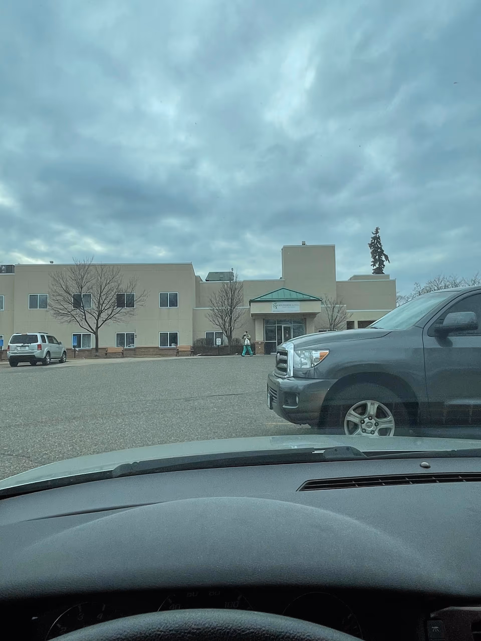 Exterior view of Southview Acres Health Care Center with parking lot and entrance.