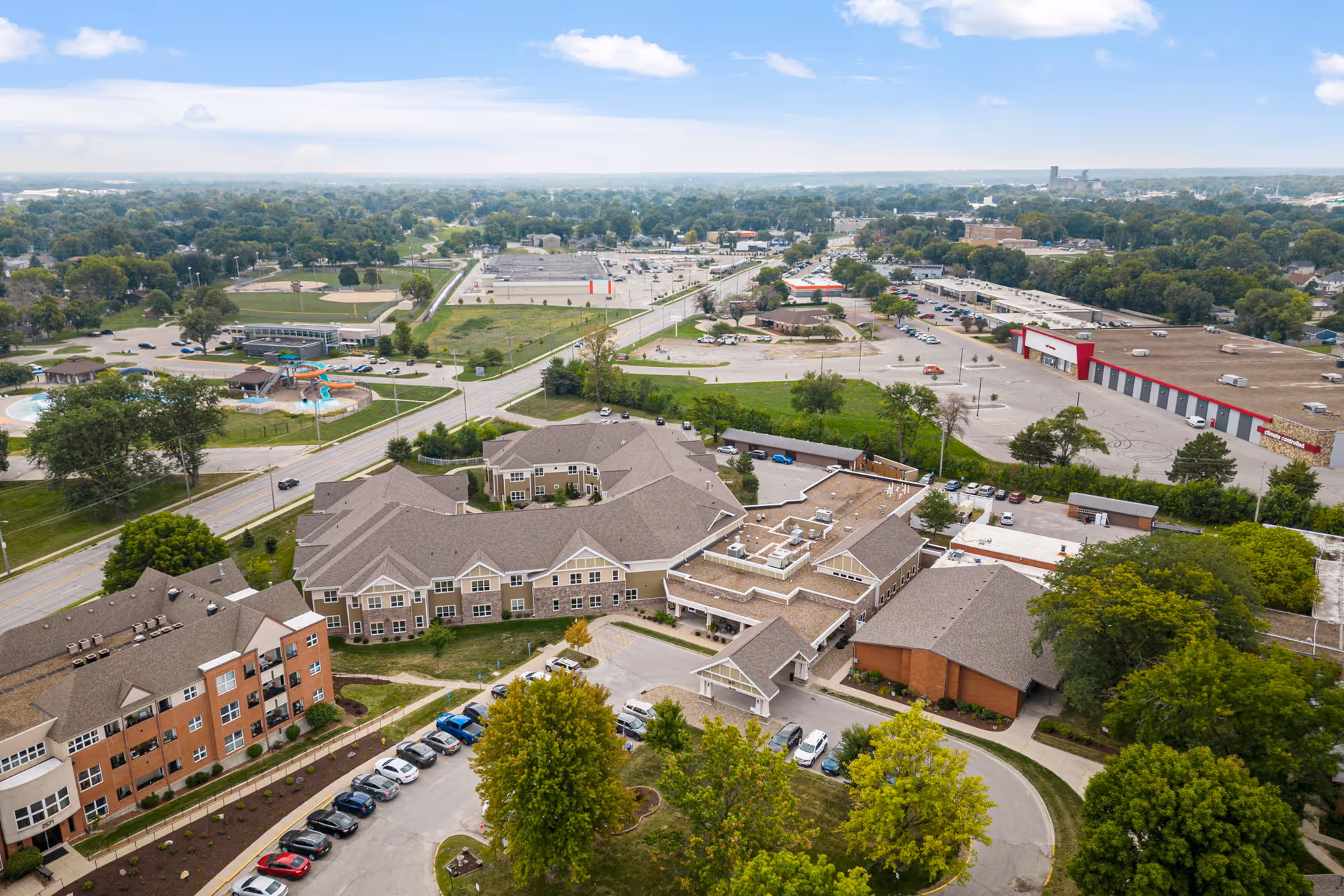 Aerial view of Valley View Village exterior with multiple buildings, parking, and surrounding roads.