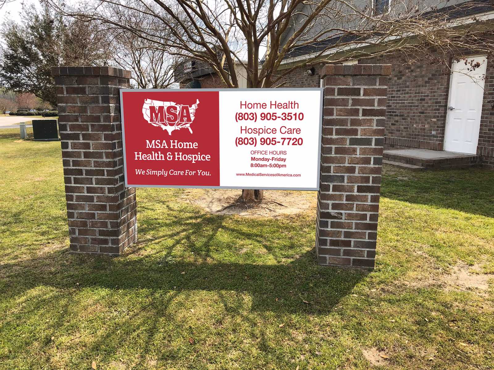 Outdoor brick-framed sign for MSA Home Health & Hospice on a grassy lawn