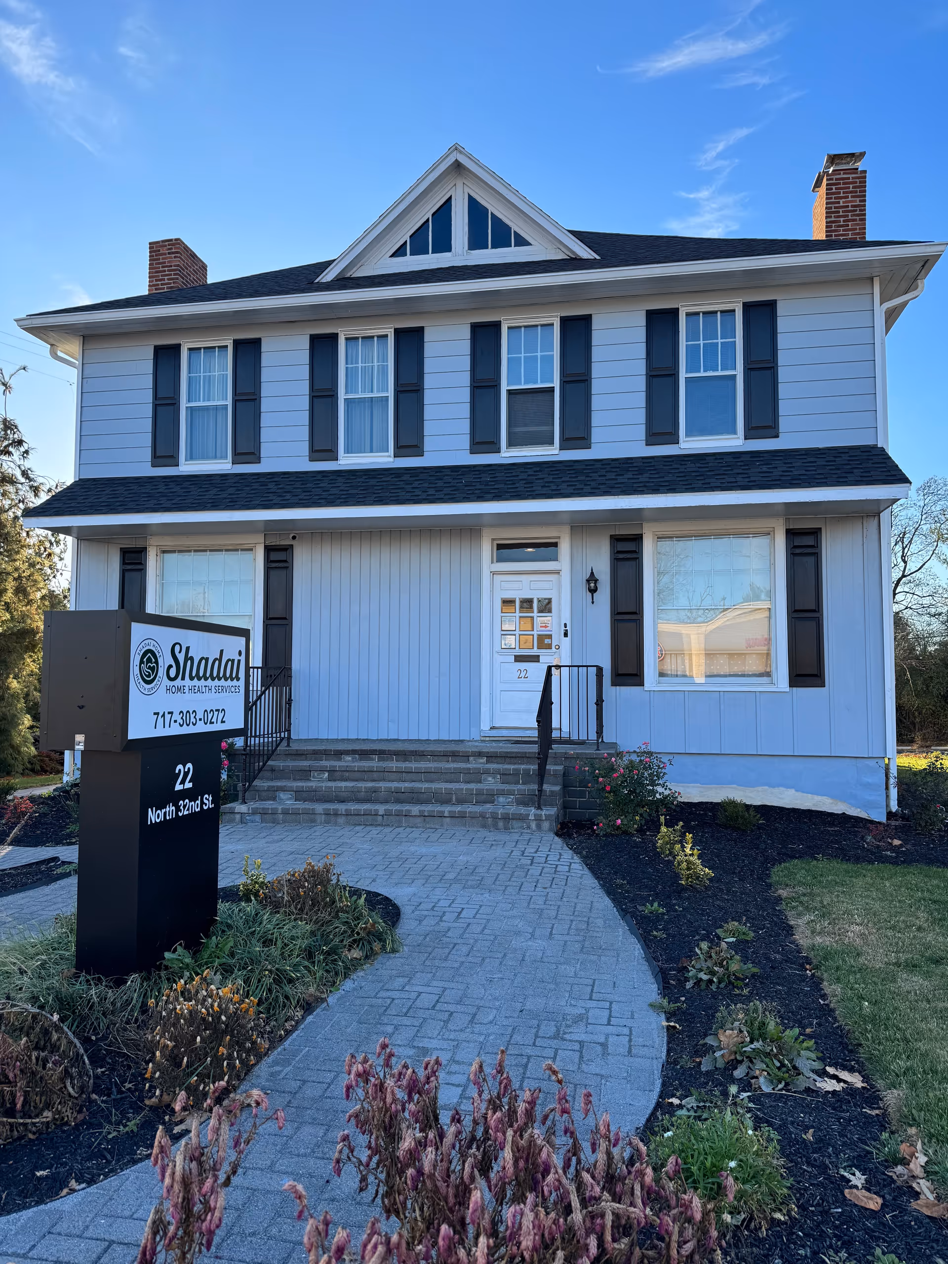 Exterior view of a two-story house-style facility with a sign reading Shadai Home Health Services LLC.