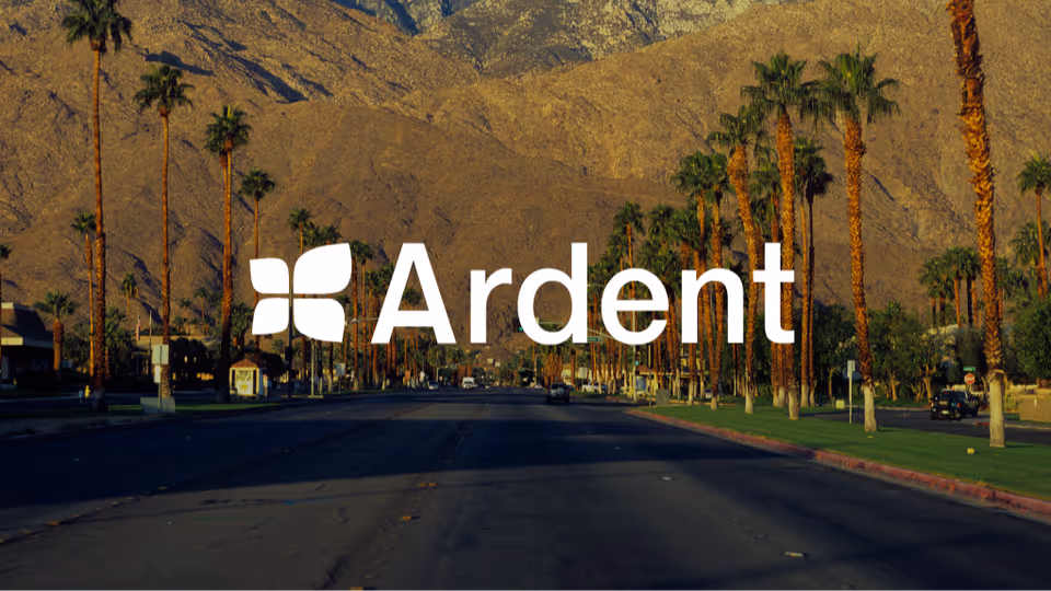 Exterior road lined with palm trees and mountains, with a large Ardent watermark across the center.