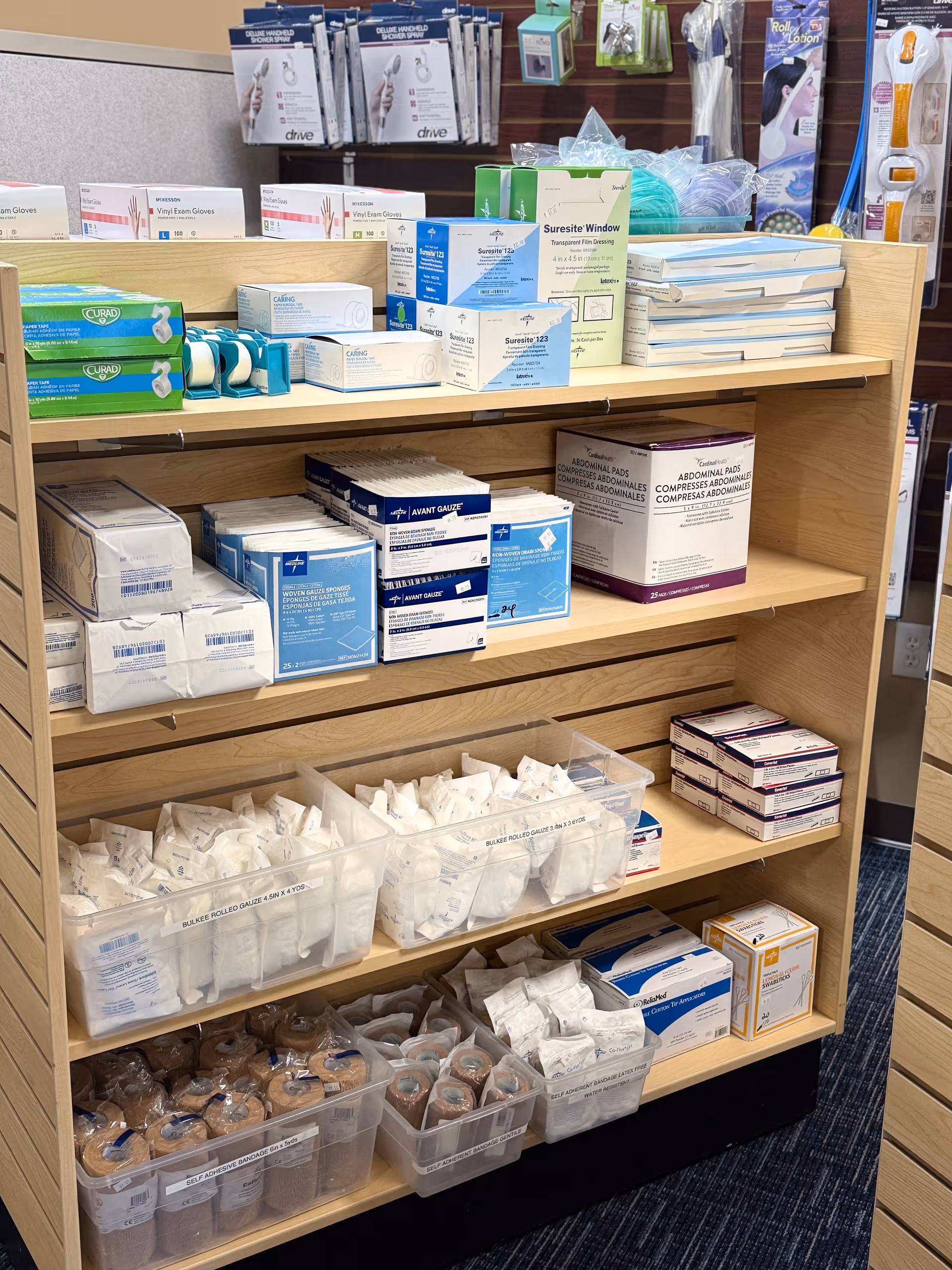 Shelves filled with medical supplies and boxes in a facility supply area.