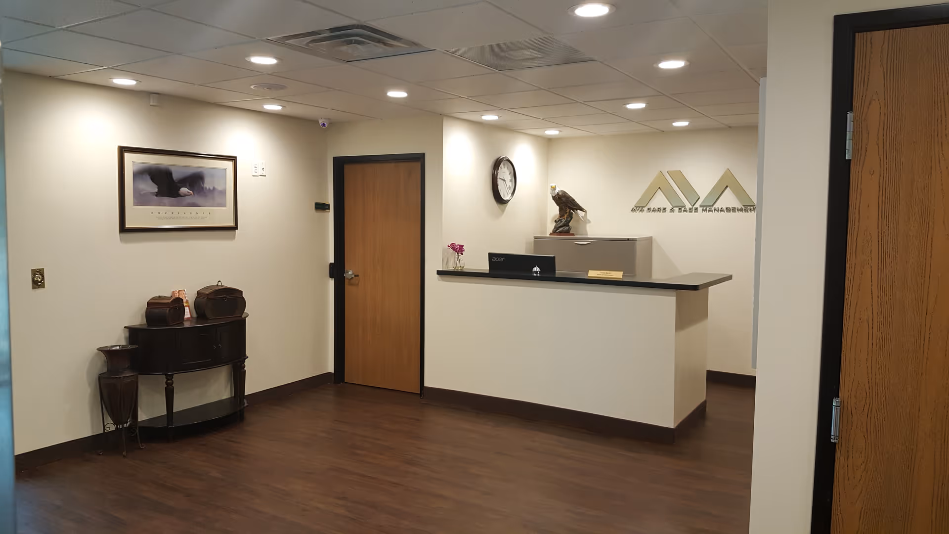 Interior reception lobby of AVA Care and Case Management with a front desk and decor.