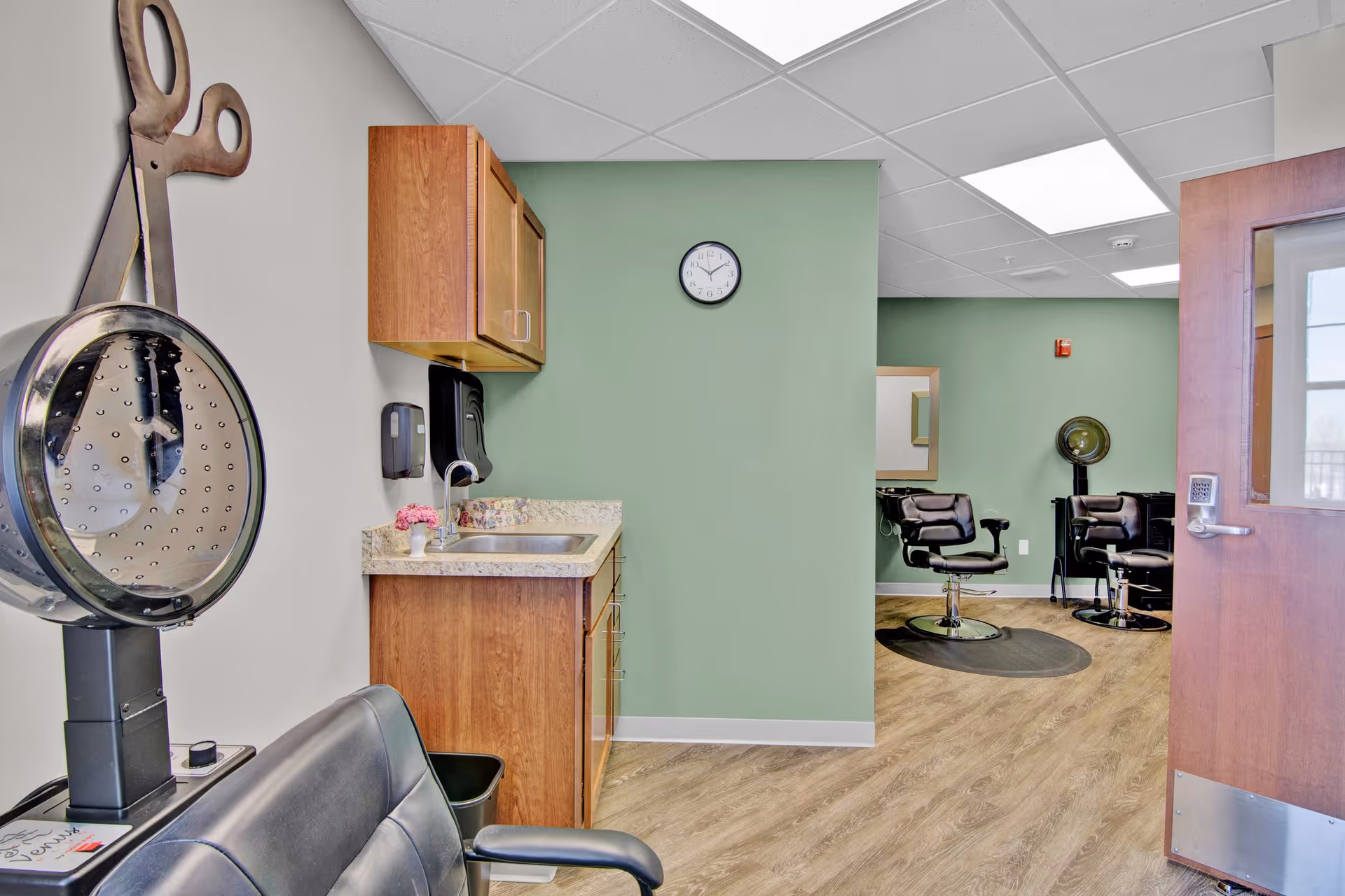 Interior view of a salon in Suite Living Senior Care of Shakopee with chairs and equipment.