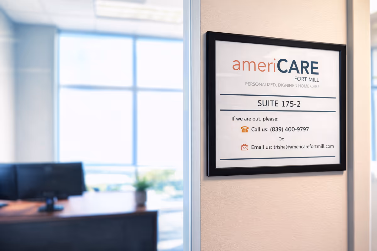 Framed ameriCARE Fort Mill sign on a wall in an office lobby