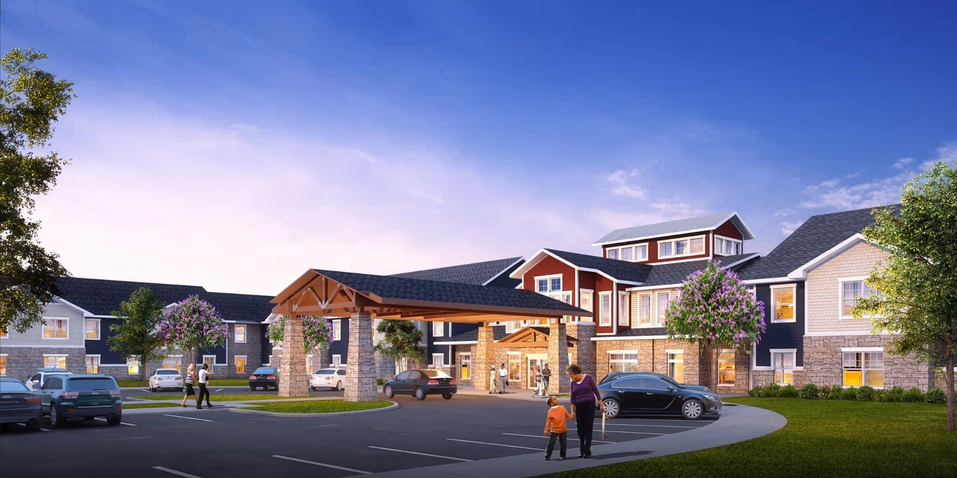 Raintree Village exterior with curved driveway, porte-cochere, parked cars, and landscaped grounds.