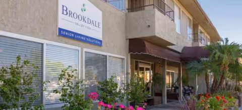 Exterior view of Brookdale Valley View with entrance, awnings, and landscaping.