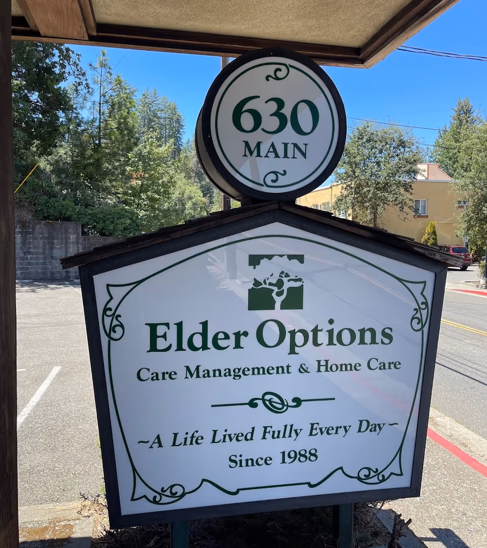 Outdoor signboard for Elder Options care management in front of a building.
