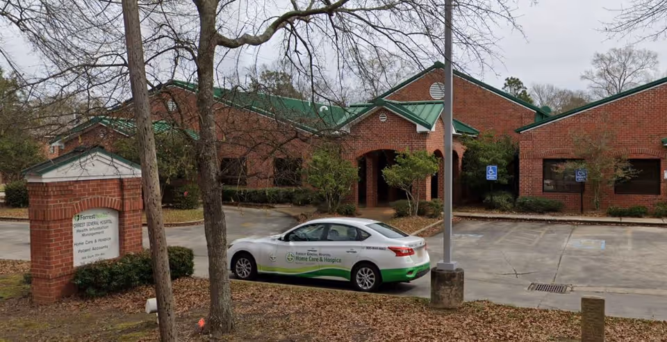 Brick Forrest General Home Care - Hattiesburg Office exterior with a parked car.