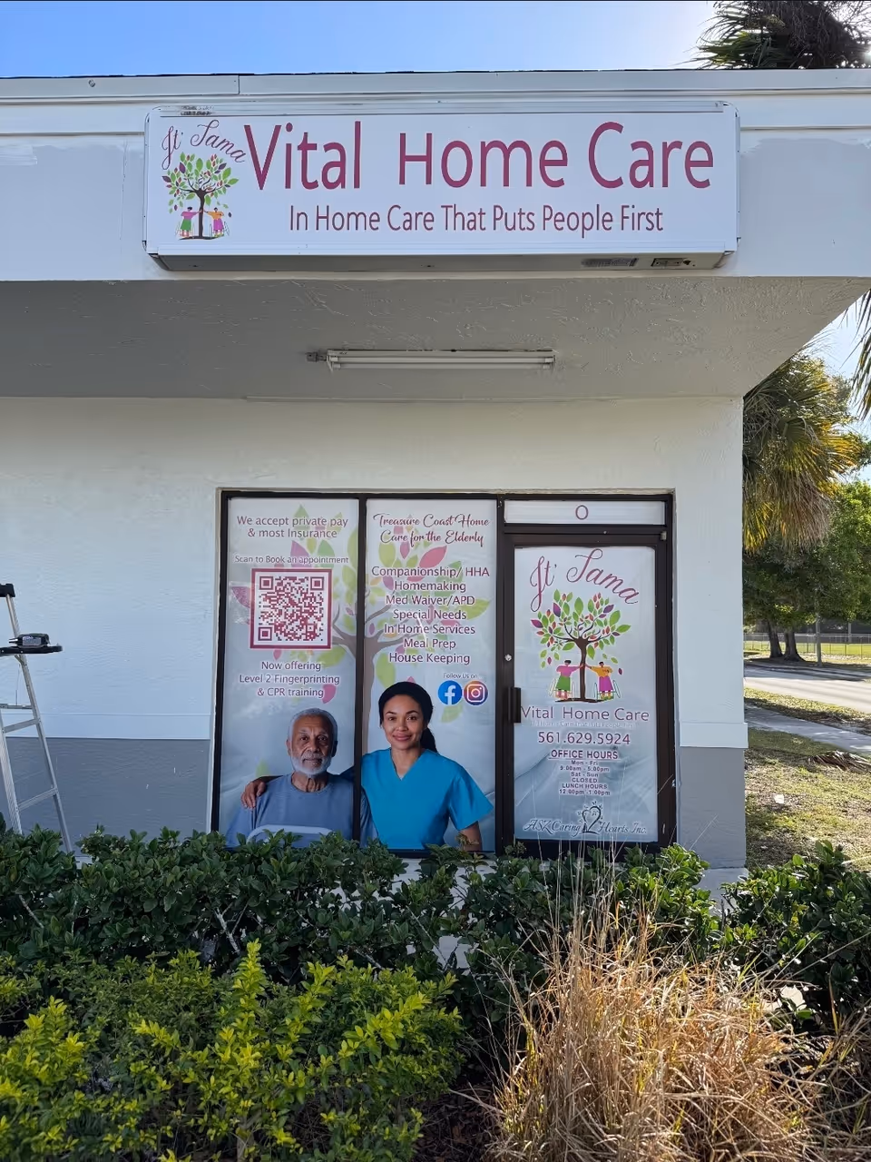 Exterior storefront of JT Tama Vital Home Care with posters