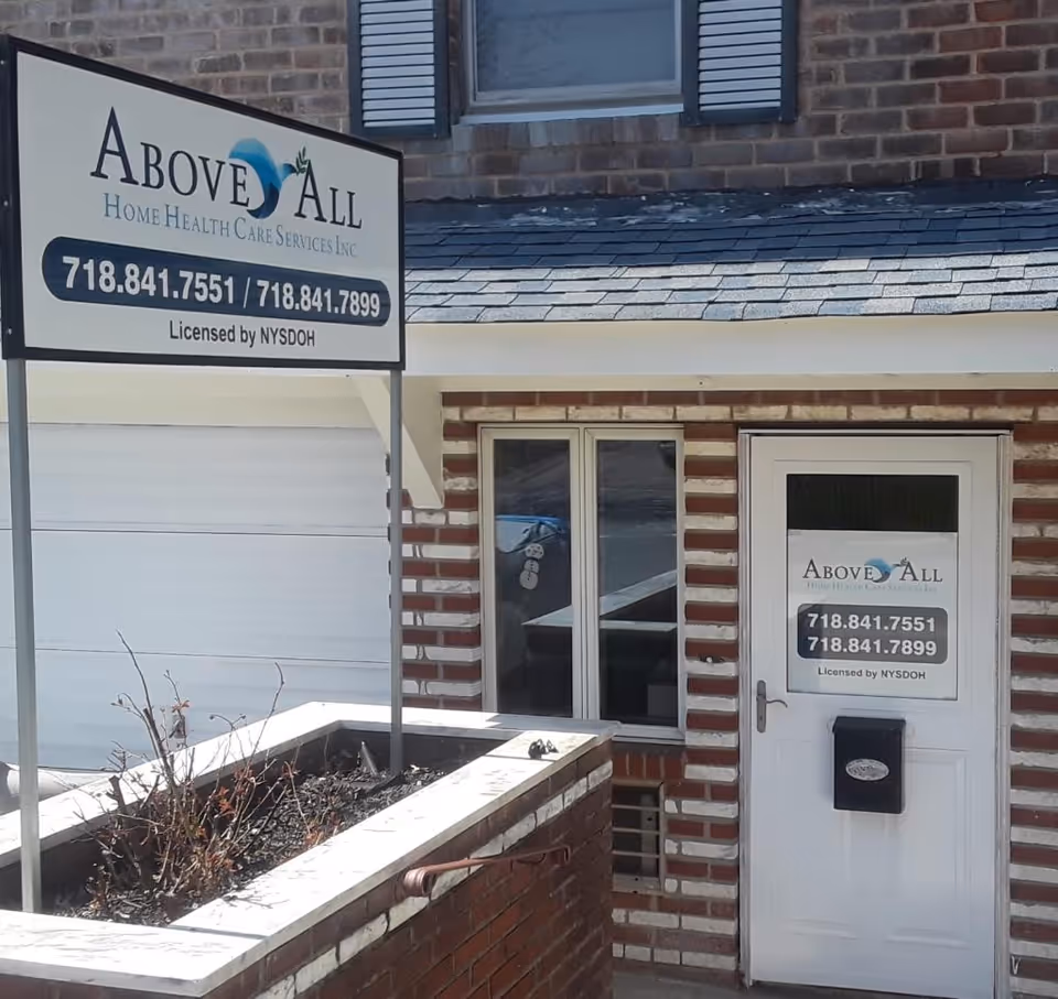 Exterior view of a brick building with Above All Home Health Care Services signage and entrance.