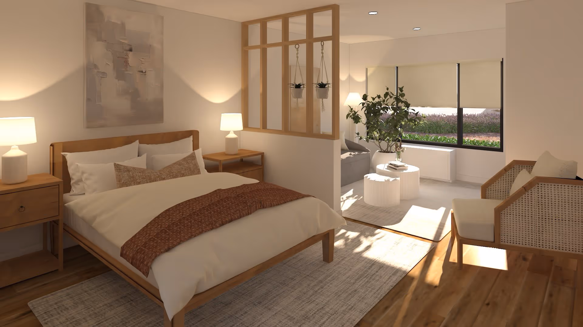 A cozy, well-lit bedroom with a wooden bed frame, white and brown bedding, two bedside tables with lamps, and a large abstract painting on the wall. The room opens into a small living area with a sofa, coffee tables, a large window with blinds, a potted plant, and a cushioned armchair. The space features wooden flooring and a partial wooden divider with hanging plants.