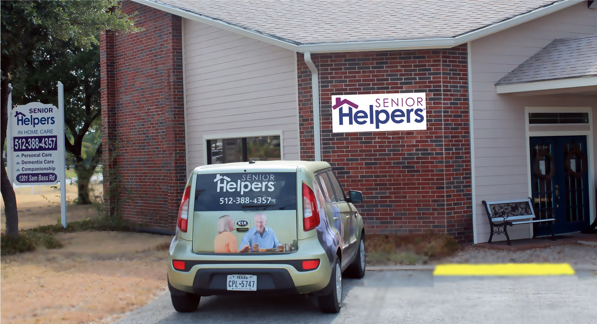 Exterior view of Senior Helpers of Austin facility with parked branded SUV.
