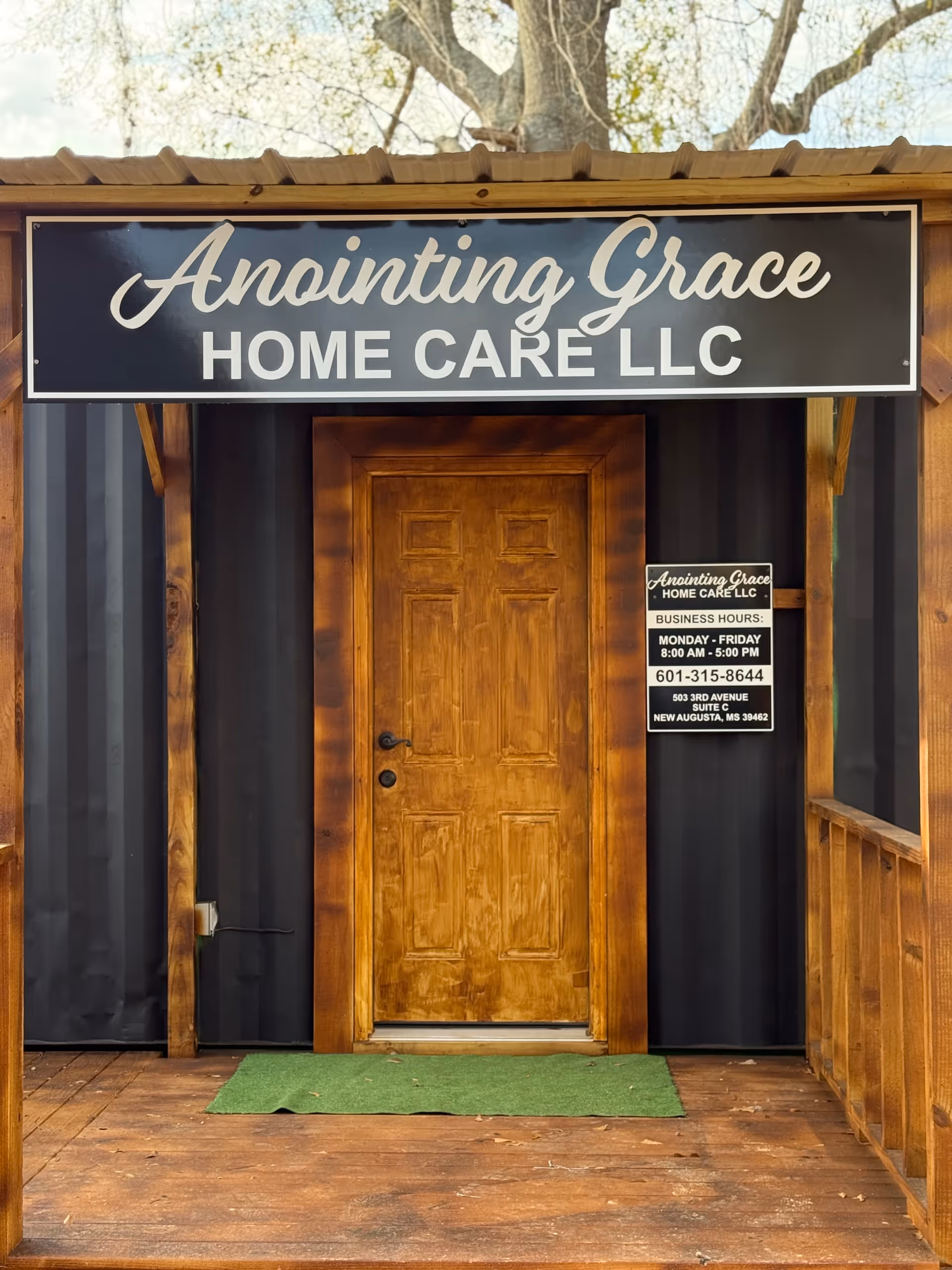 Exterior view of Anointing Grace Home Care LLC entrance with a wooden door