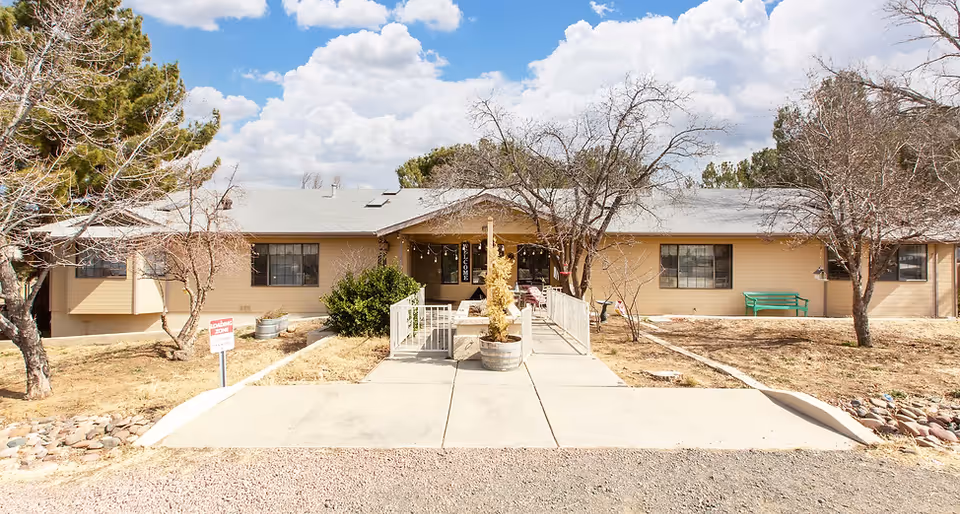 Single-story Desert Haven AZ facility with sidewalk, ramps, and front entrance.