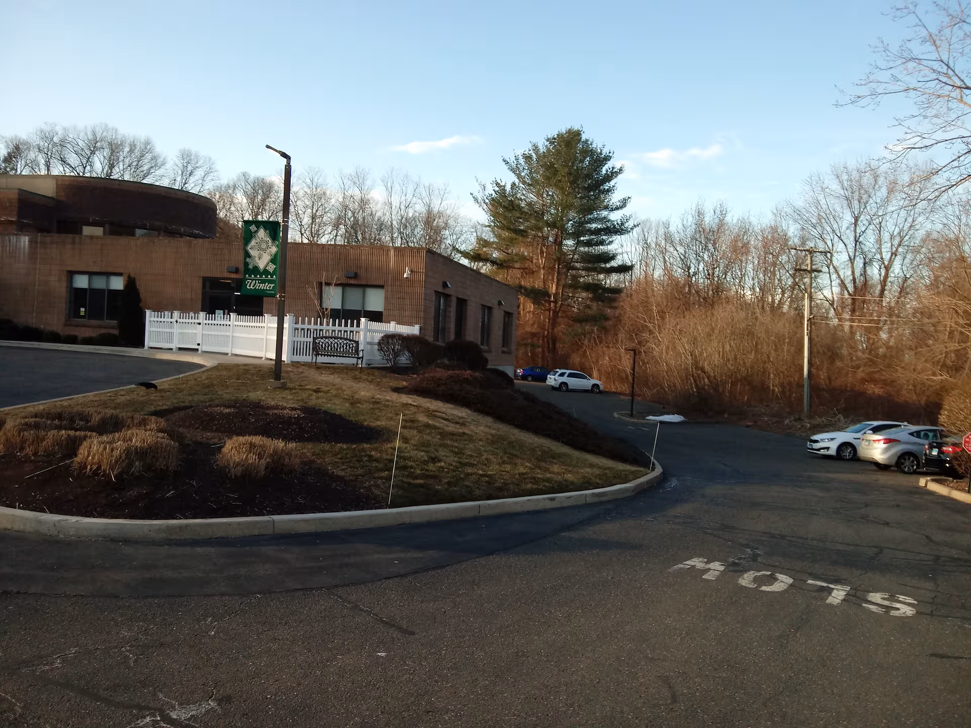 Exterior view of Vernon Rehabilitation and Healthcare Center with a parking lot.