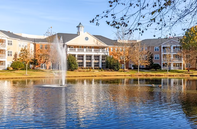 Front view of Woodland Terrace building with a fountain pond in the foreground.