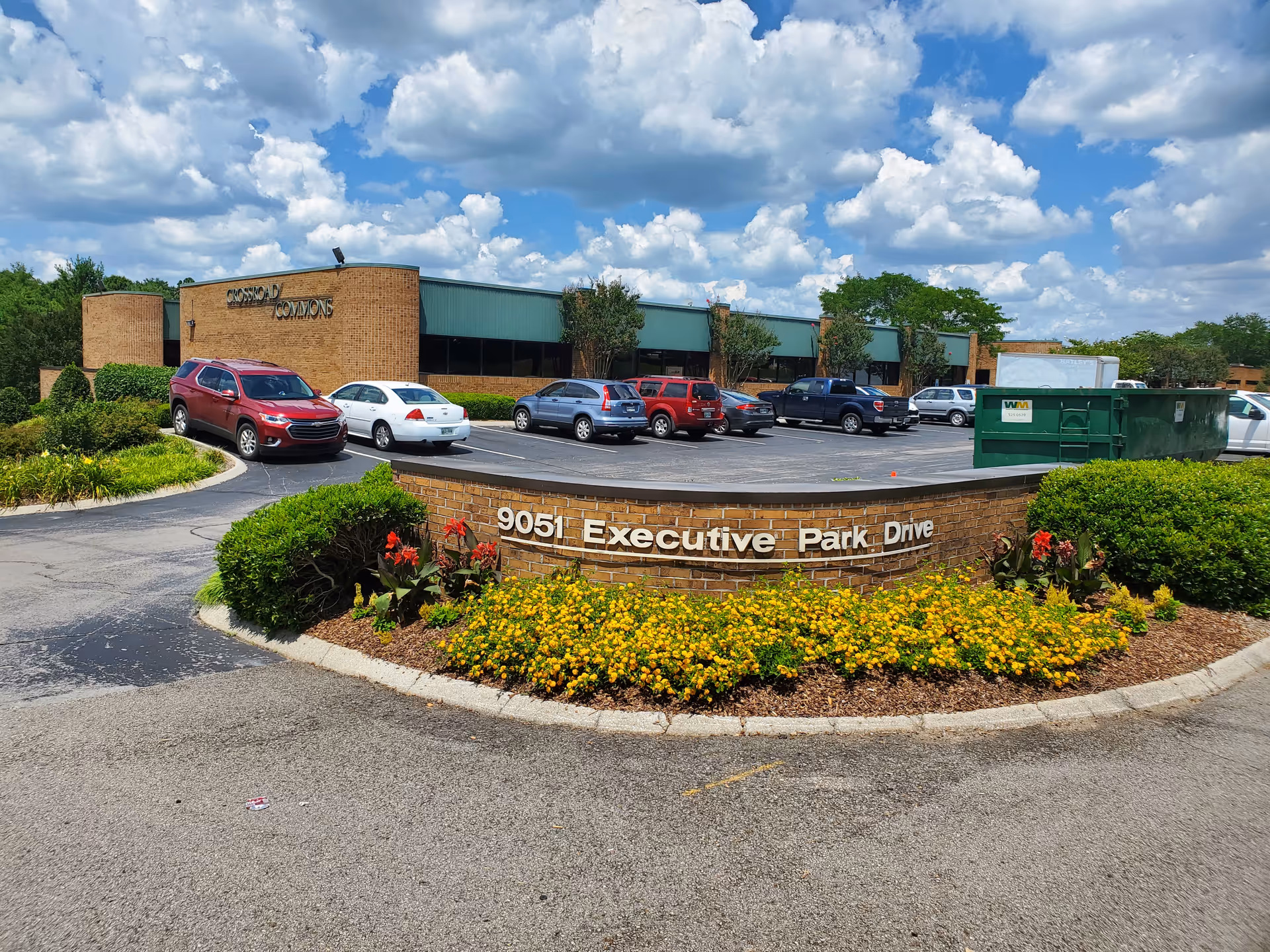 Exterior view of Senior Solutions Home Care facility with landscaped entrance and parking lot.