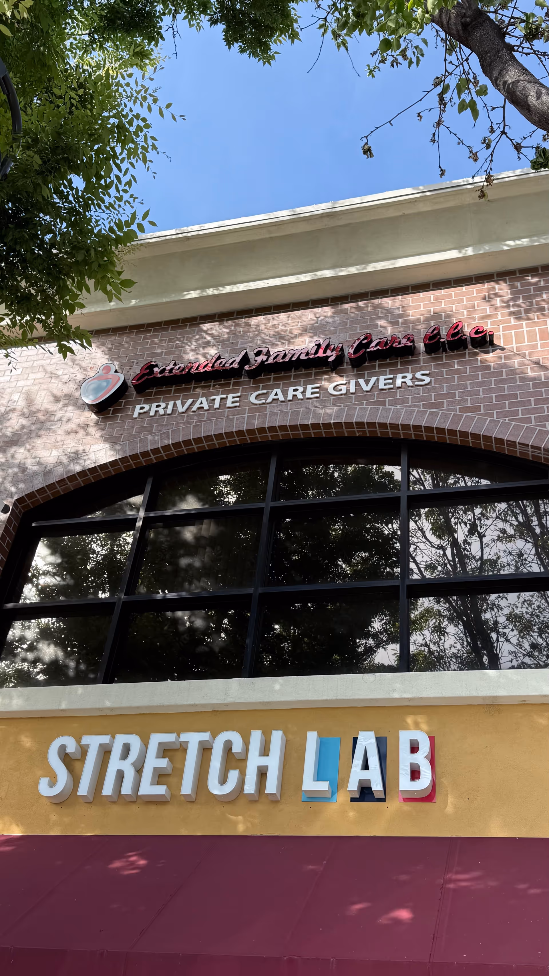 Front exterior of a building showing Extended Family Care sign and Stretch Lab storefront.