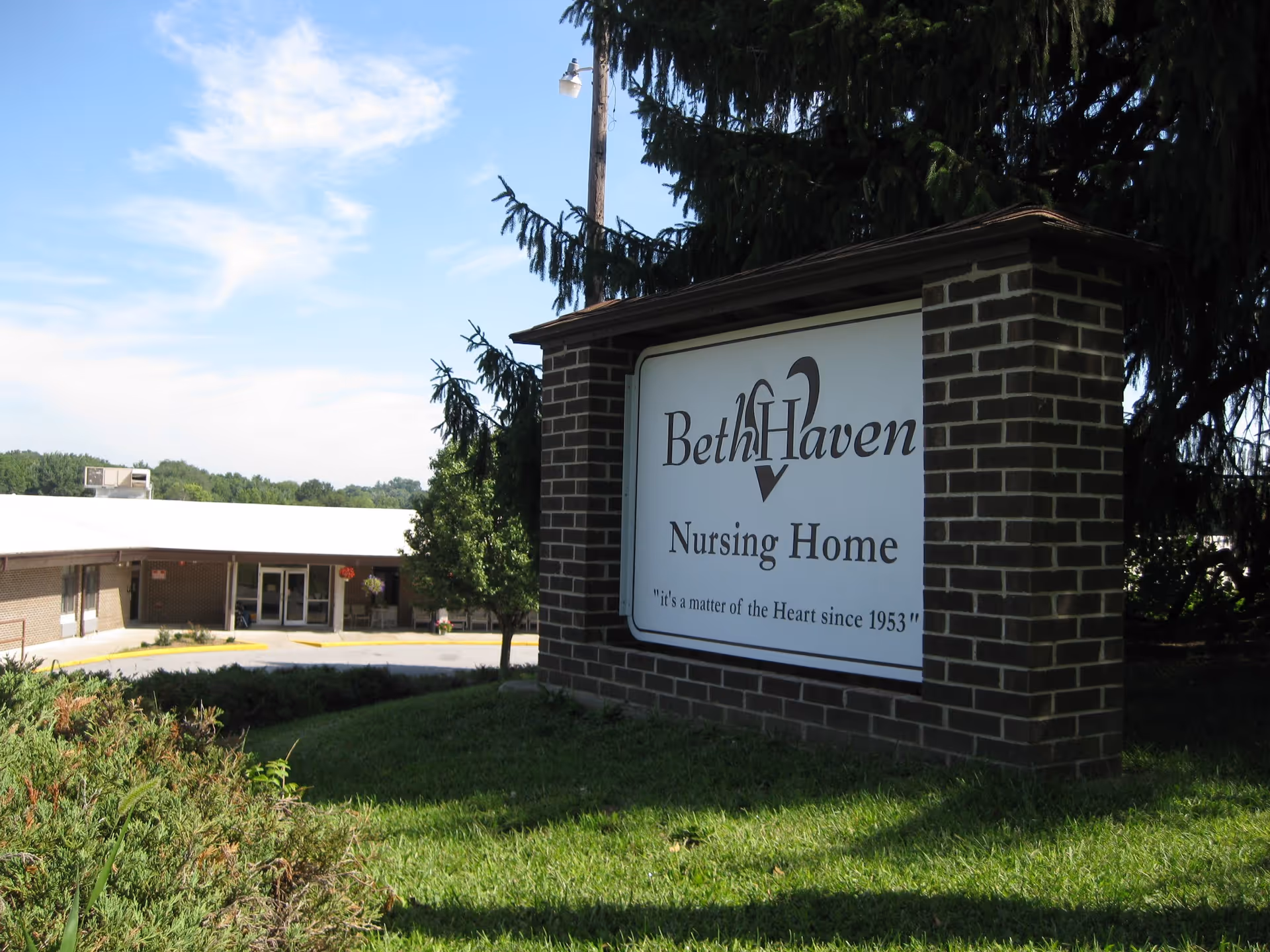 Exterior view of Beth Haven Nursing Home sign and brick entrance pillar