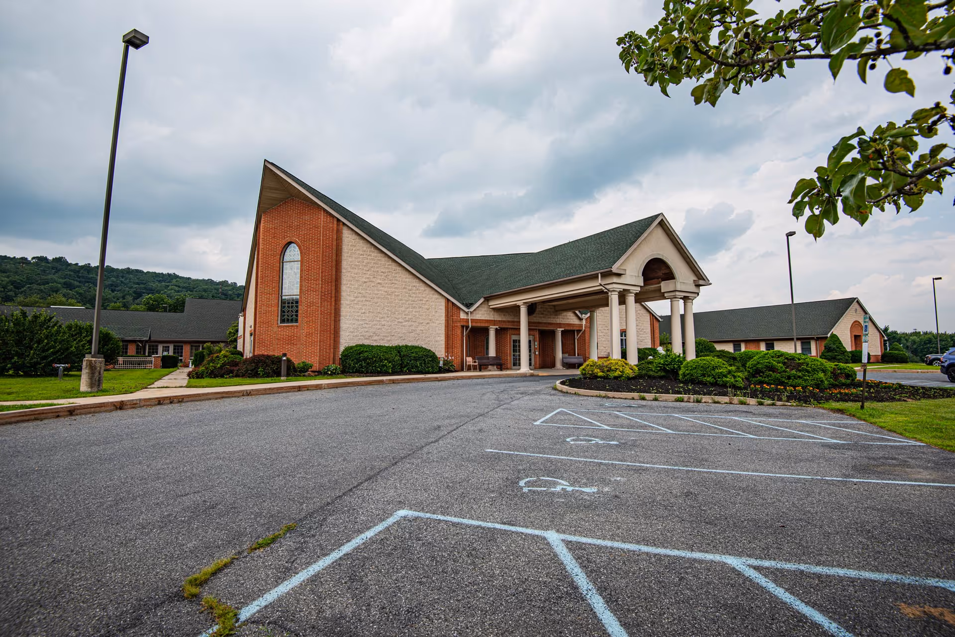 Front view of Seton Manor Nursing and Rehabilitation Center exterior with a parking lot.