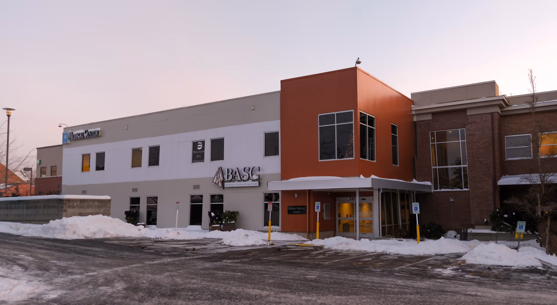 Exterior view of Bellingham Ambulatory Surgery Center in a snowy parking lot.