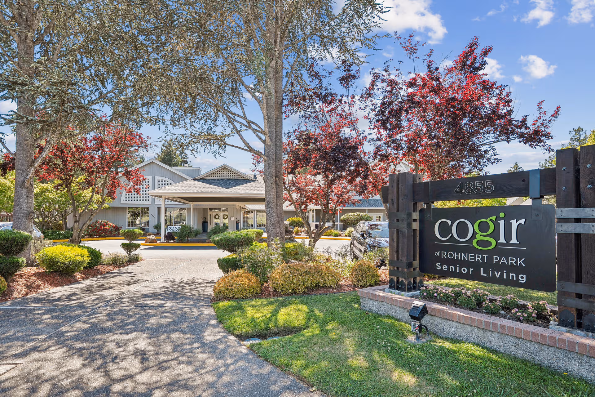 Front exterior of Cogir of Rohnert Park Senior Living with landscaped entrance.