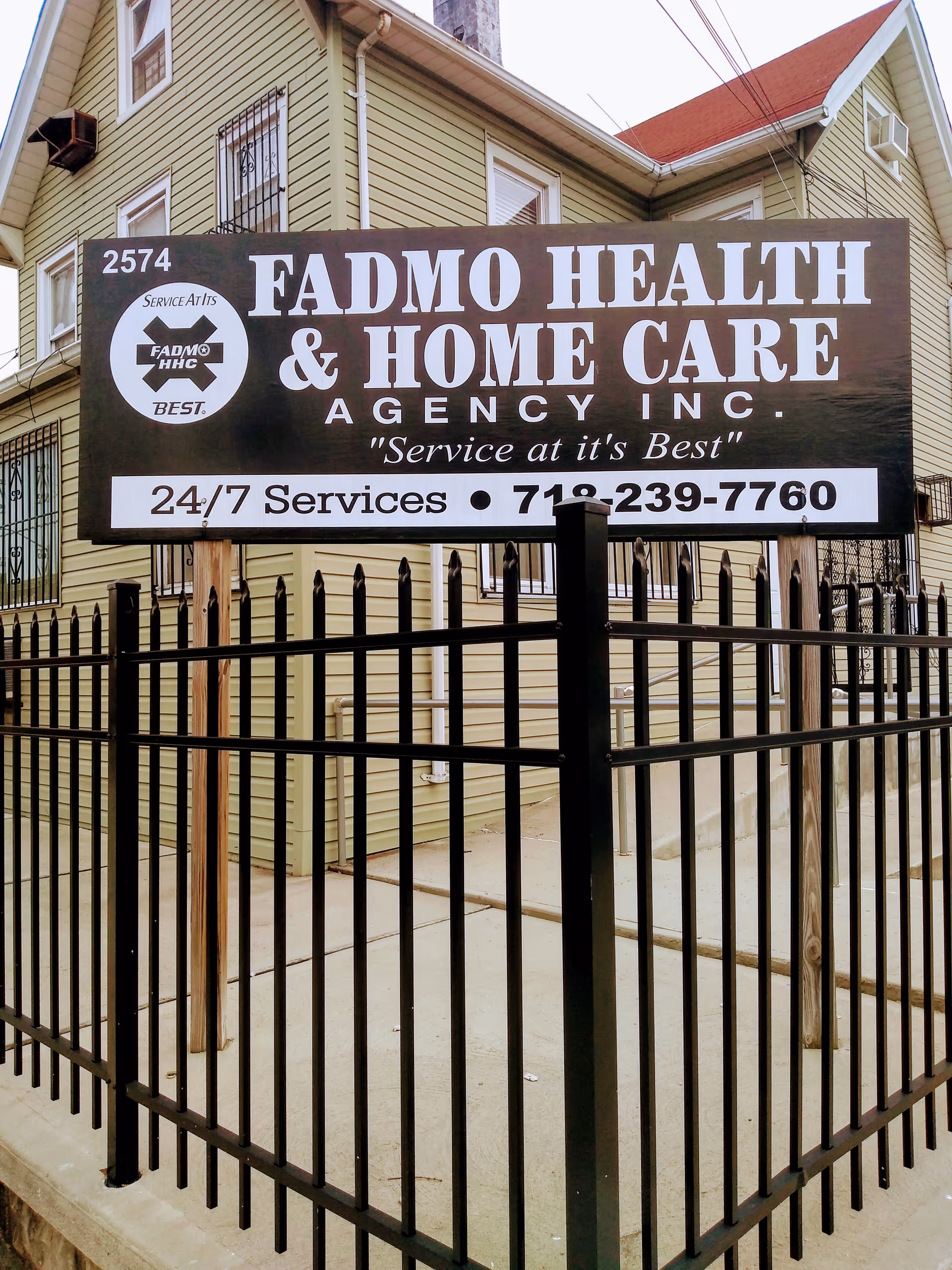 A large sign on a beige building advertises FADMO HEALTH & HOME CARE AGENCY INC.