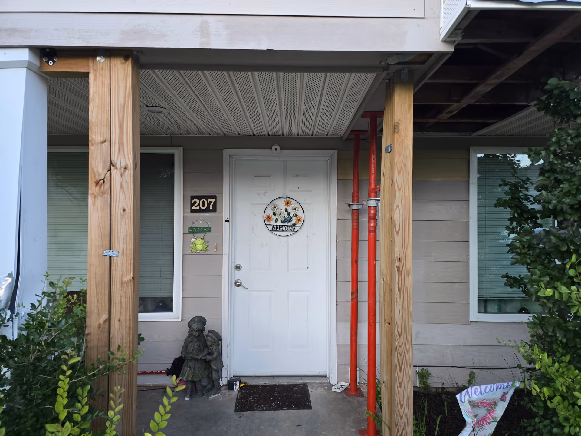 Front entrance of a senior apartment building with a wreath on the door.