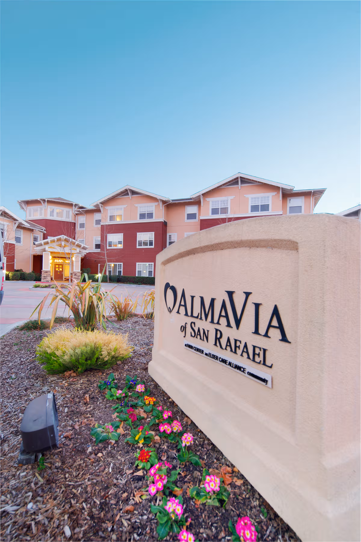 Exterior view of AlmaVia of San Rafael with sign and landscaping