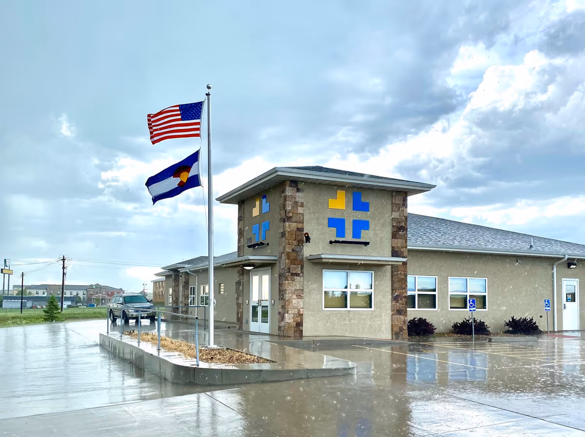 Exterior view of Lincoln Health Community Hospital with flags and entrance
