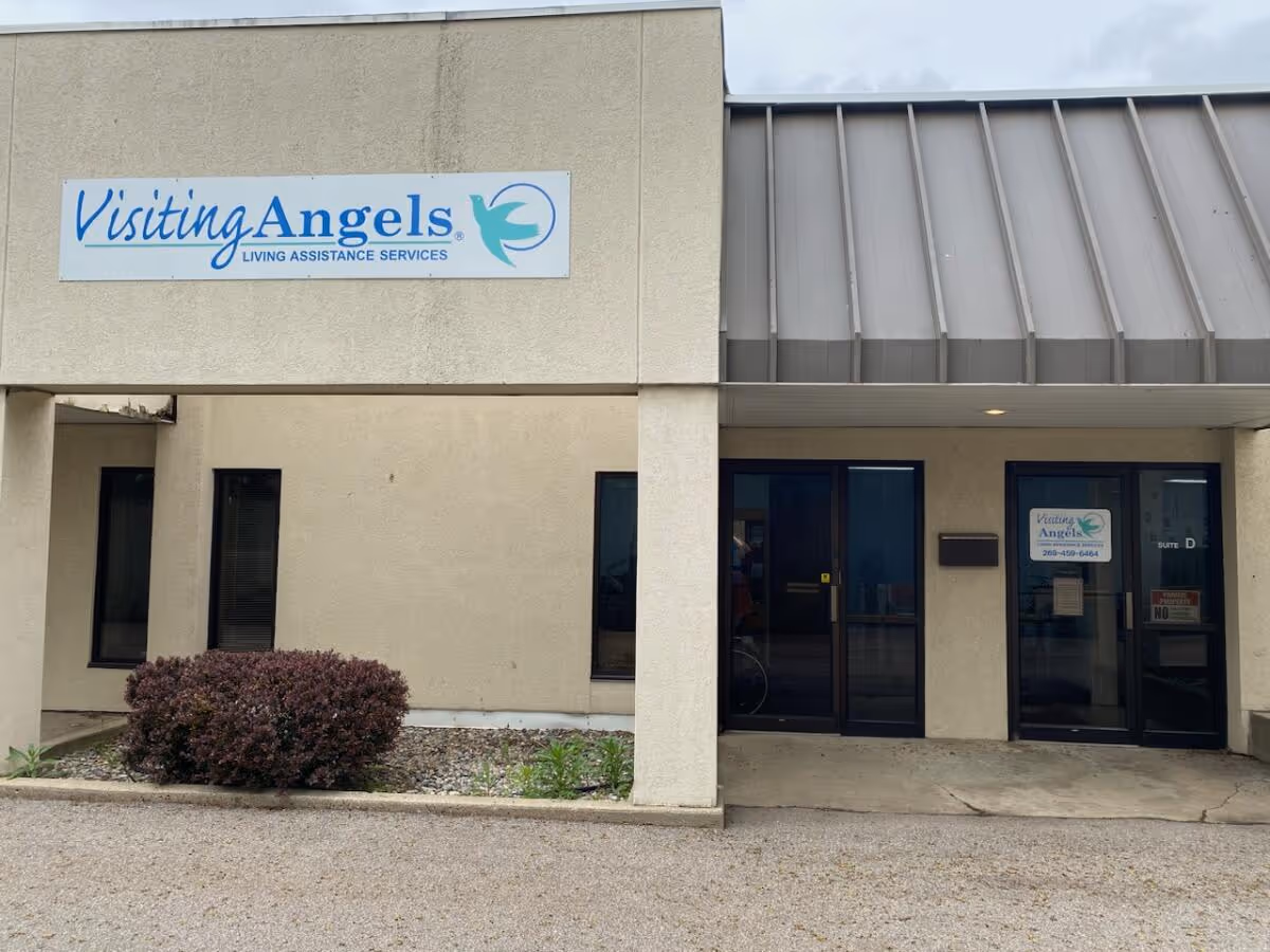 Exterior view of Visiting Angels building with sign and glass doors at the entrance