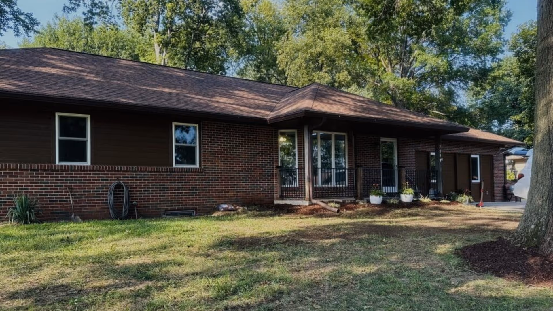 Exterior of Autumn Home Plus 3, a single-story brick facility with front porch.