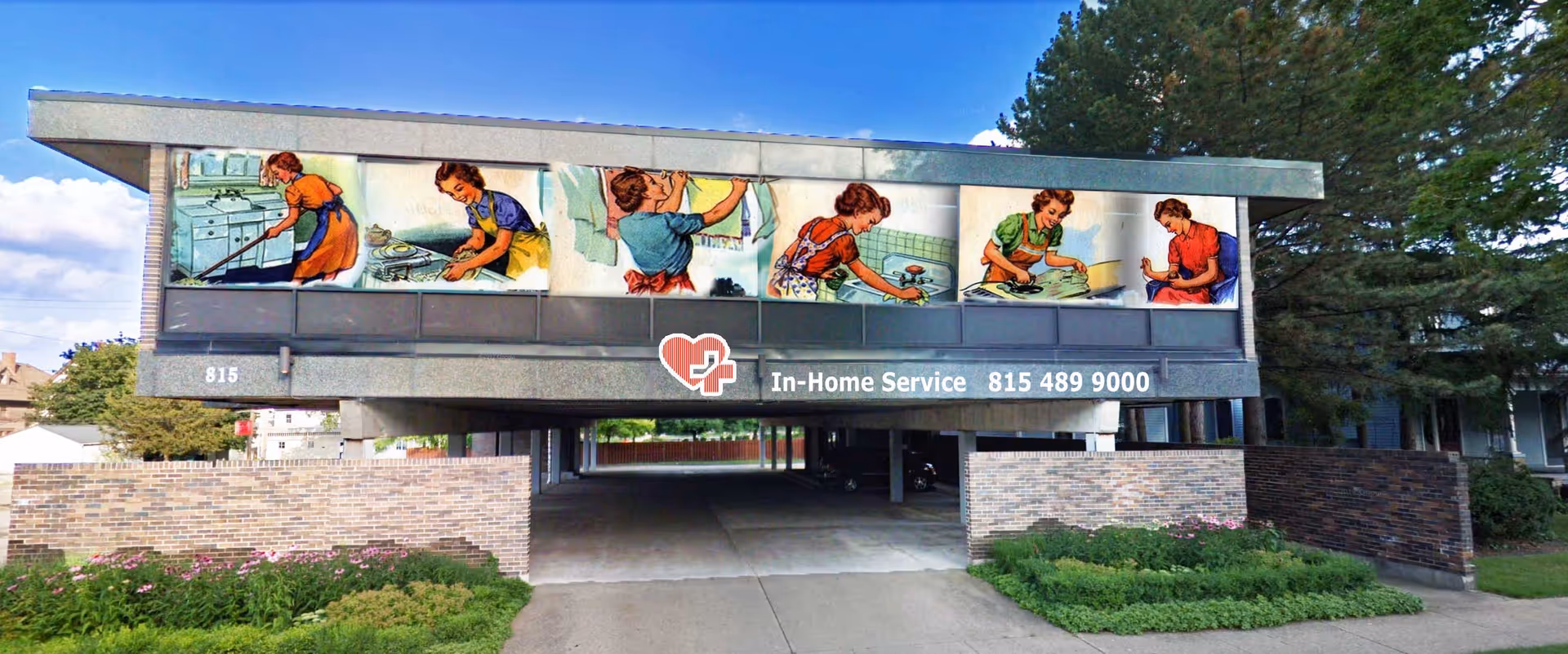 Front view of a brick-clad building with a wide mural and an In-Home Service sign.