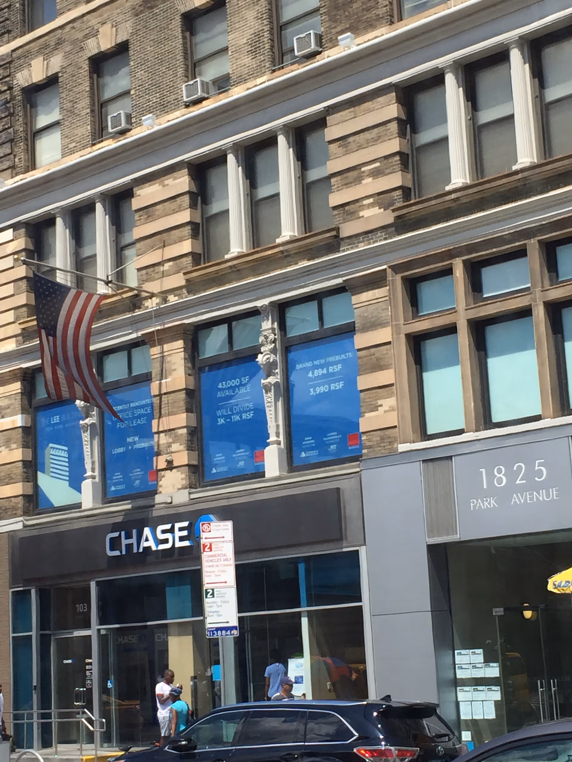 Brick building facade with Chase bank storefront and blue window signage along Park Avenue