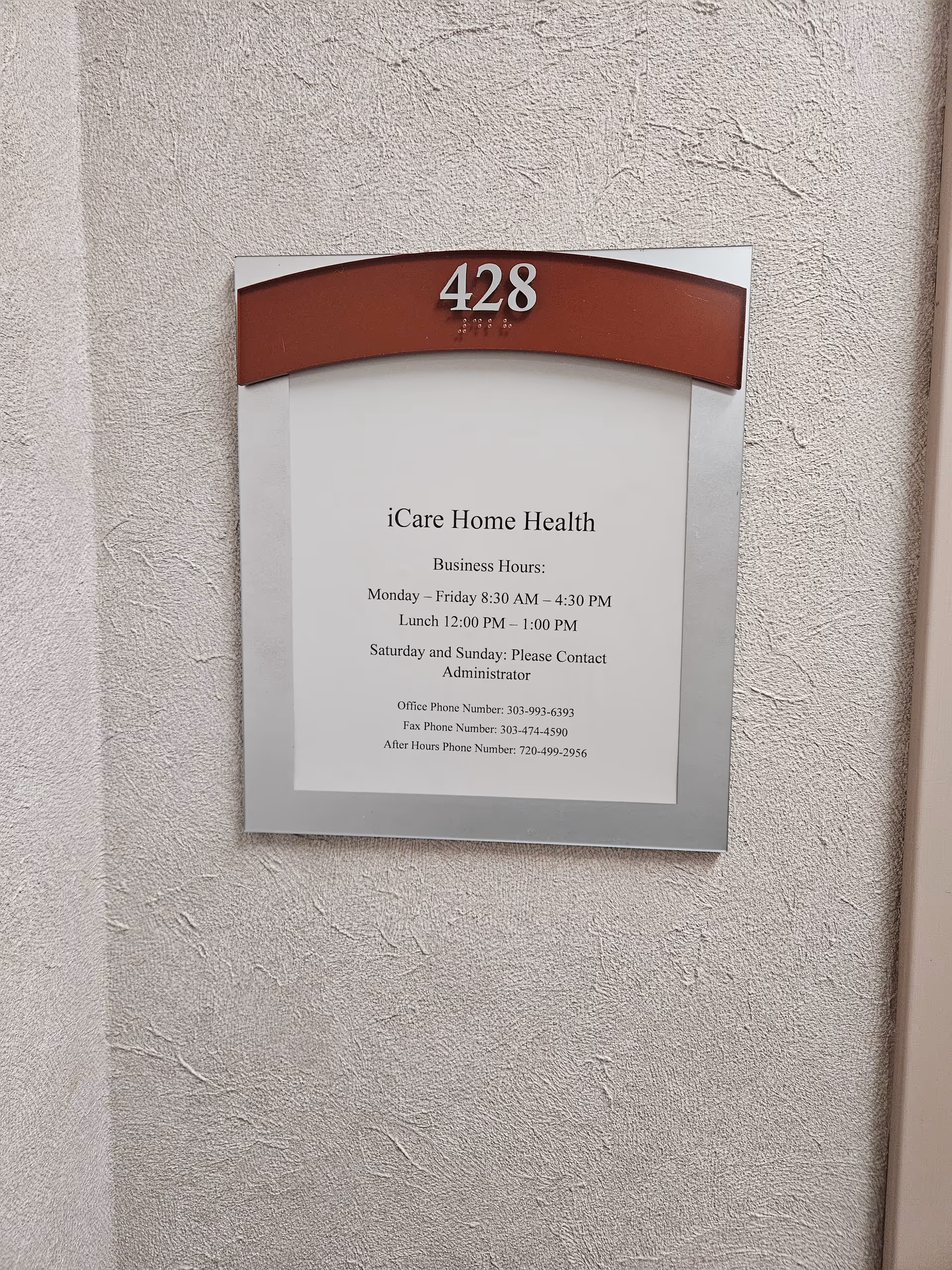 Exterior wall plaque showing address 428 for iCare Home Health Agency