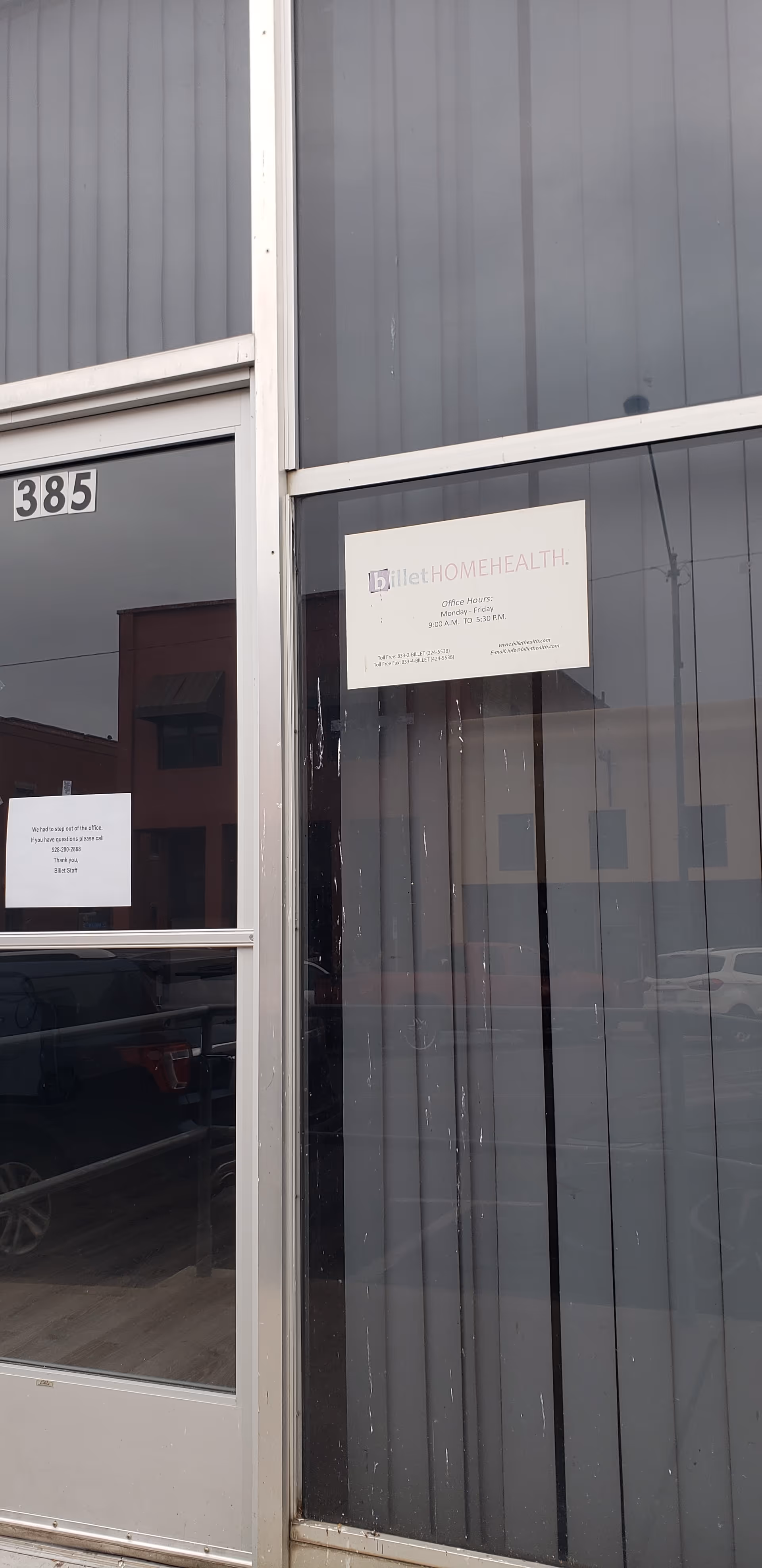 Exterior view of Billet Health building entrance with glass doors and signage.