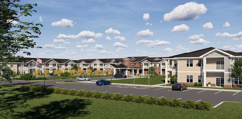Exterior view of StoryPoint Medina senior living campus with parking and landscaped grounds.