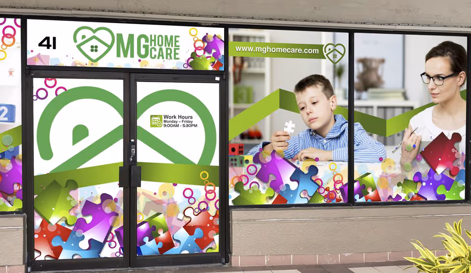 MG Home Care storefront with green logo and colorful puzzle-piece graphics on windows