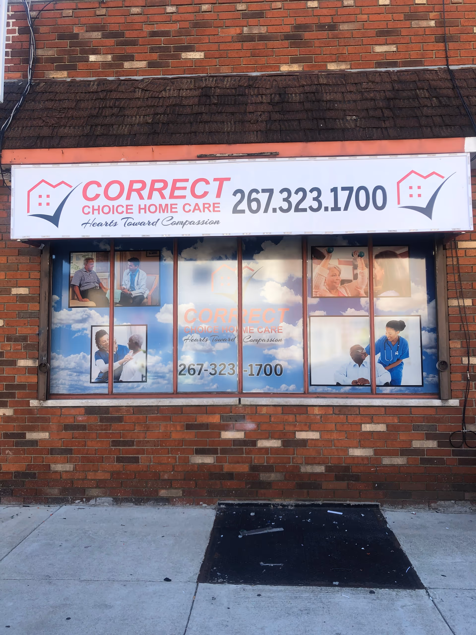 Brick storefront displaying Correct Choice Home Care sign with phone number and window advertisements.