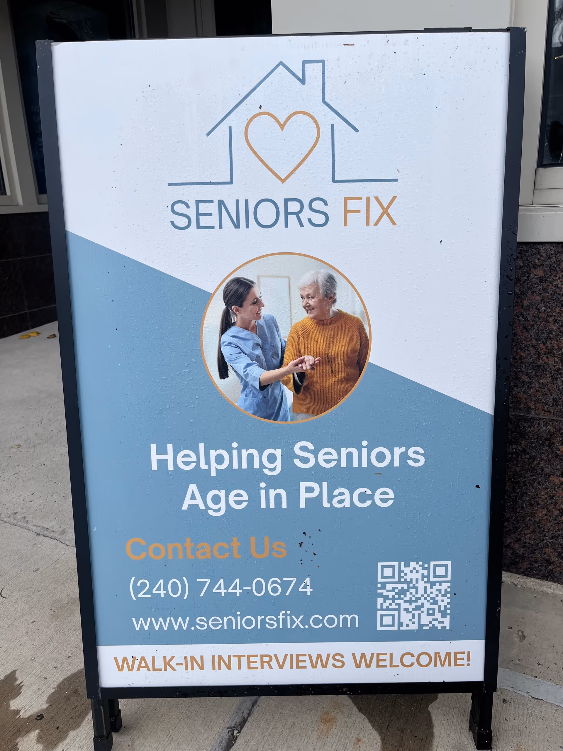 Outdoor signboard advertising Seniors Fix with logo, photo, and contact details.