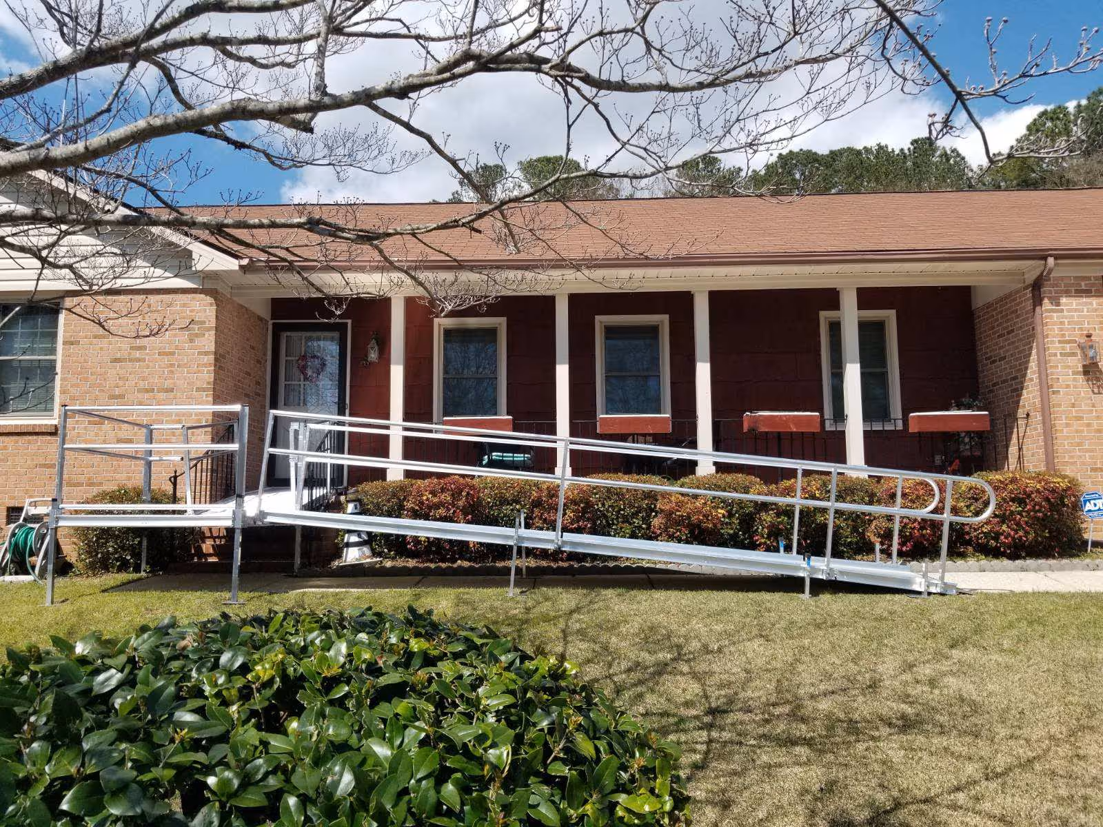 Front exterior of Centerspan Medical facility with a wheelchair ramp and bushes.
