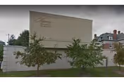 Exterior view of Regency Healthcare & Rehab Center with a large sign and trees.