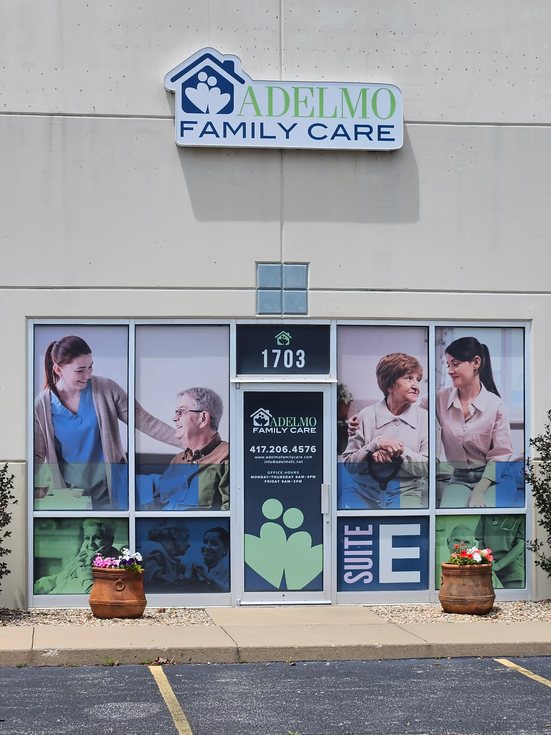 Front exterior of Adelmo Family Care with sign and large window graphics.