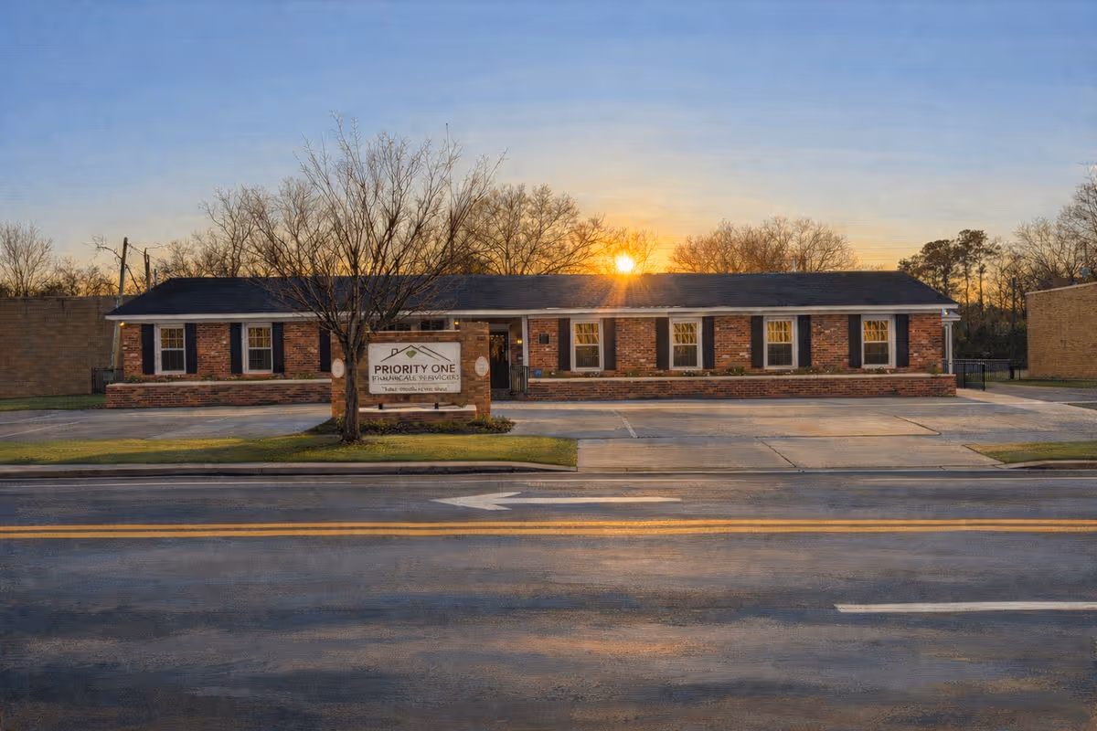 Single-story brick building with a Priority One Home Healthcare sign in front.