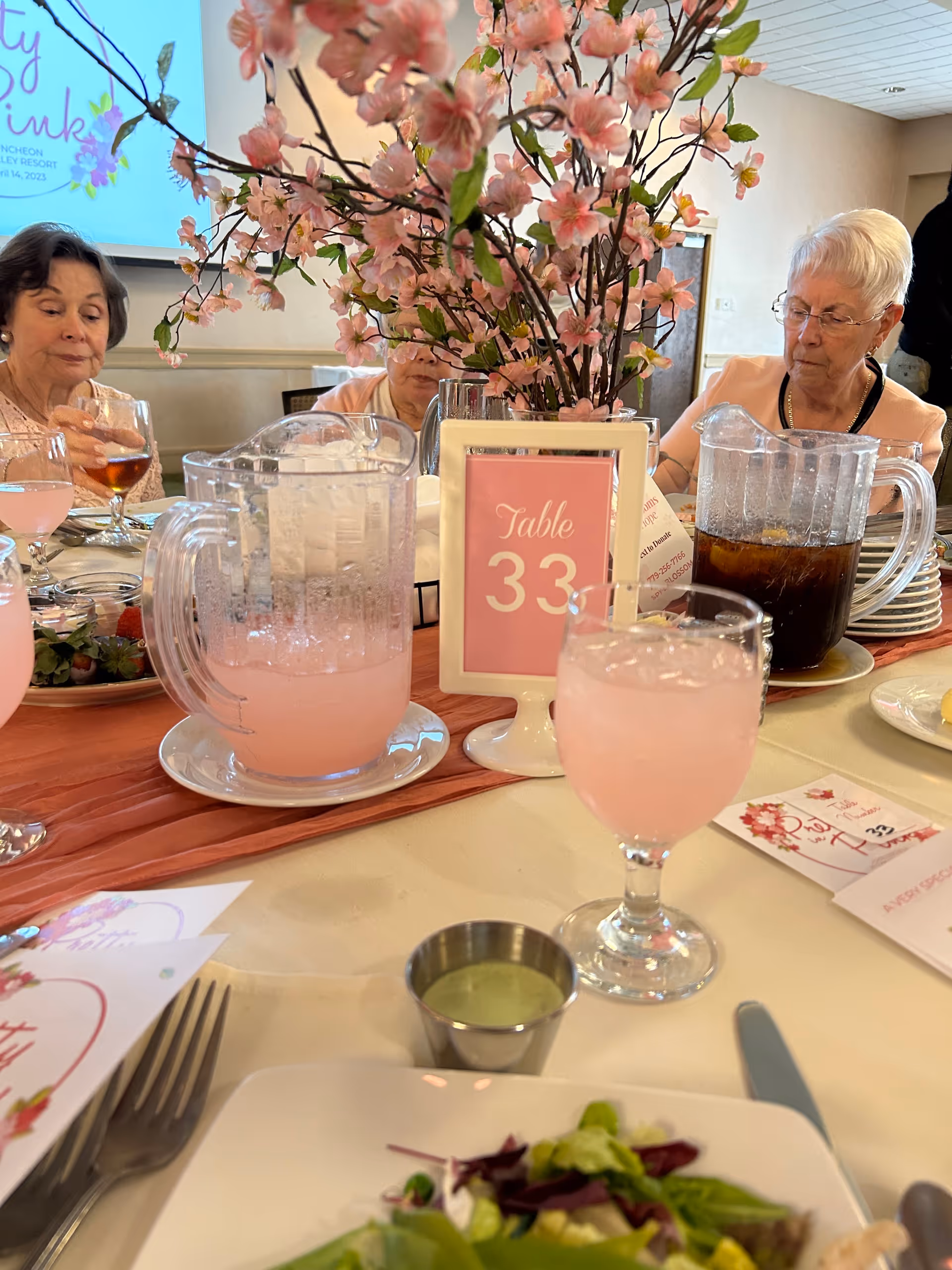 Residents dine together at a decorated table in The Lutheran Village at Miller's Grant dining room.