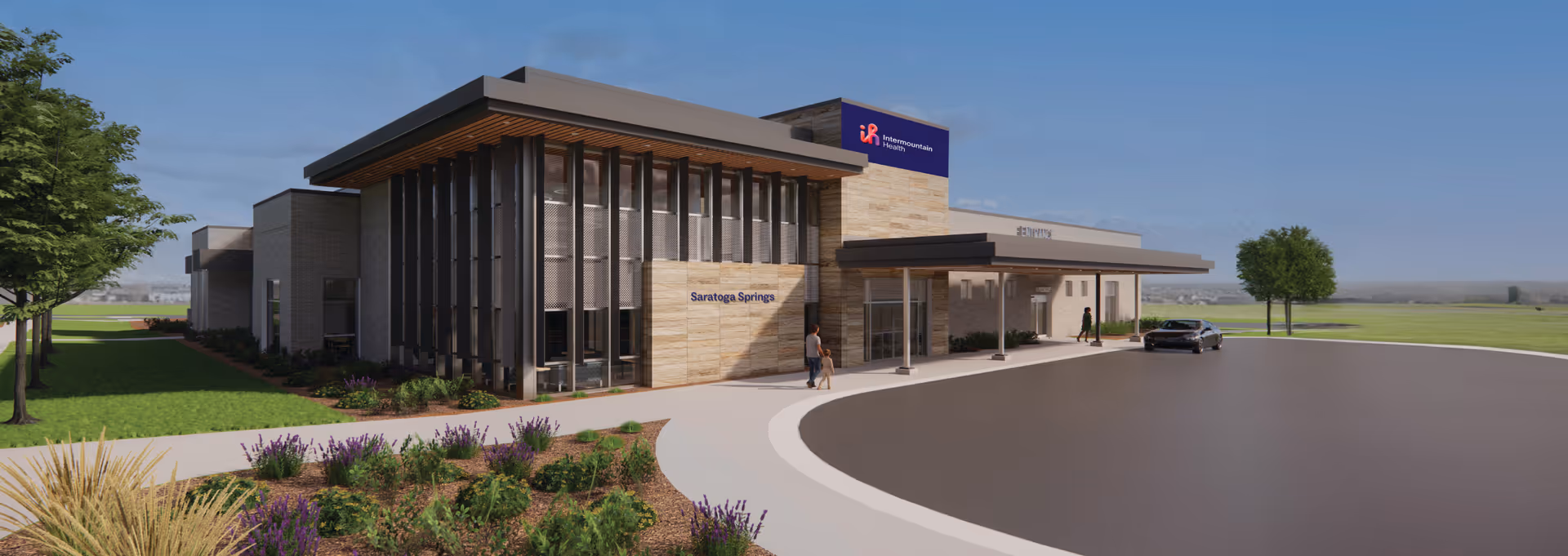 Exterior view of Saratoga Springs Surgery Center with landscaped entrance and circular driveway.