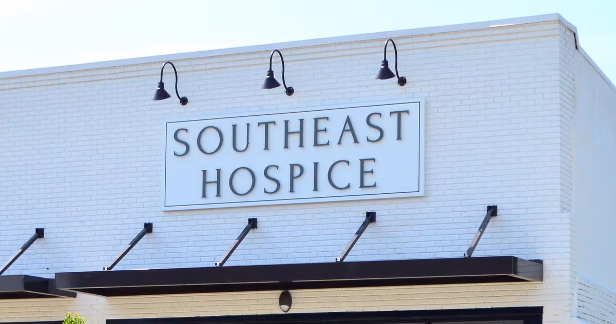 White brick building with a large Southeast Hospice sign on the front
