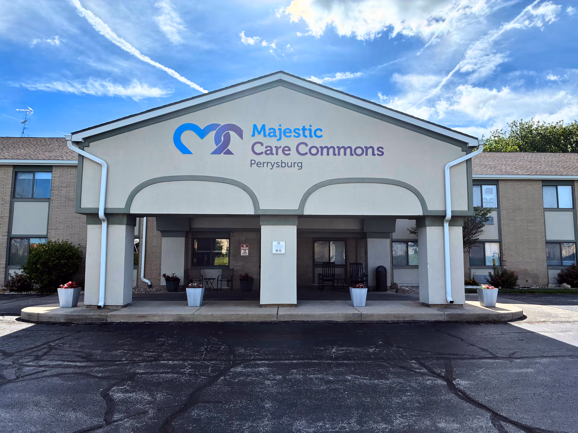 Front view of Perrysburg Commons entrance with arches and blue signage