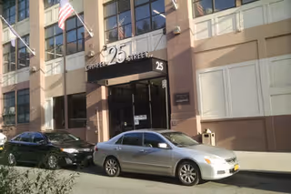 Exterior view of the Gateway Counseling Center building entrance with parked cars.